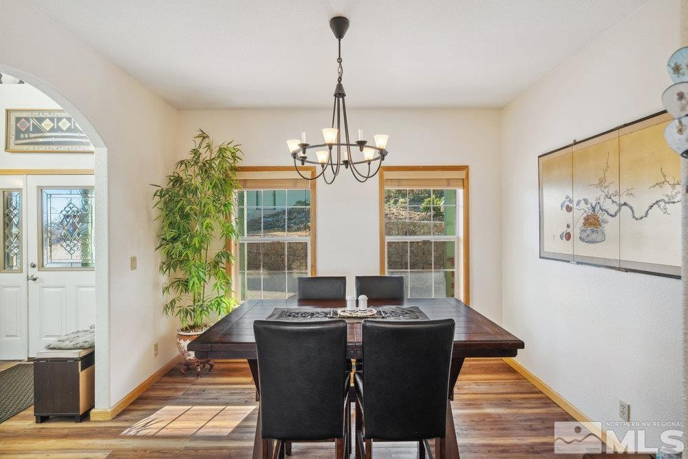 2045 Flint Road Reno, NV 89521 - Photo 9 of 33 a view of a dining room with furniture window and wooden floor