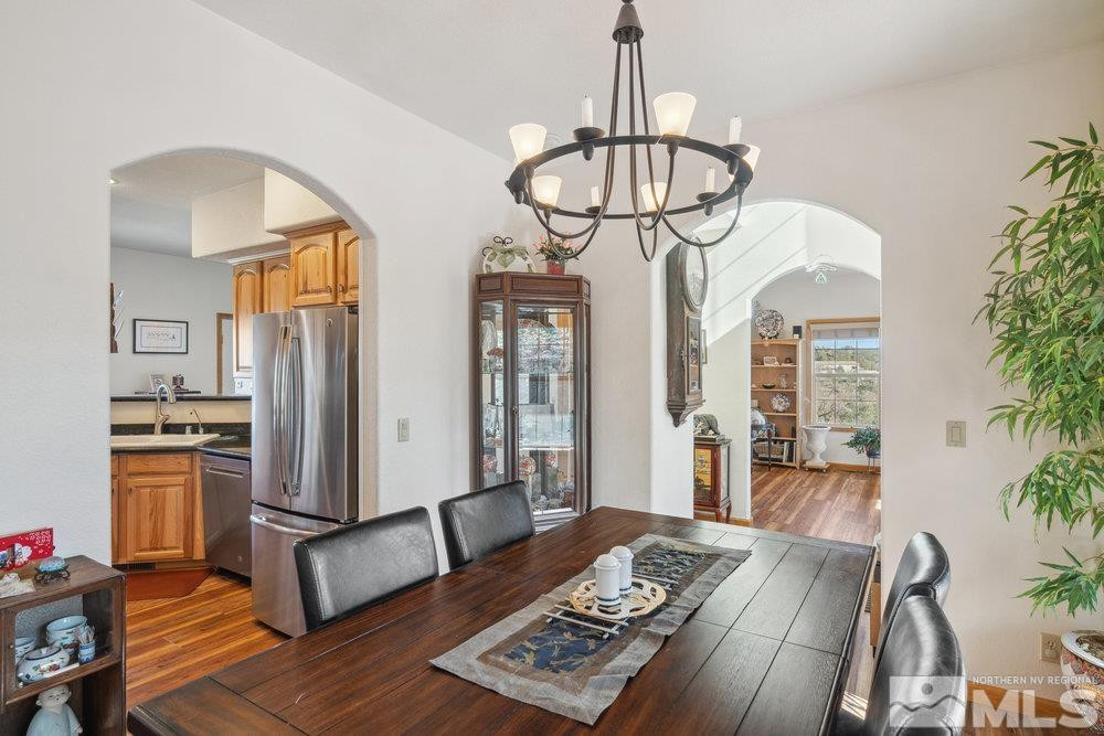 2045 Flint Road Reno, NV 89521 - Photo 10 of 33 a view of a dining room with furniture window and wooden floor