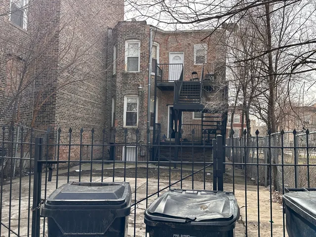 a view of a patio with couches and table and chairs