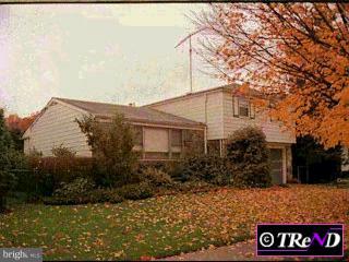 9712 Chapel Road Philadelphia, PA 19115 - Photo 1 of 1 a view of a blue house with yard and a tree