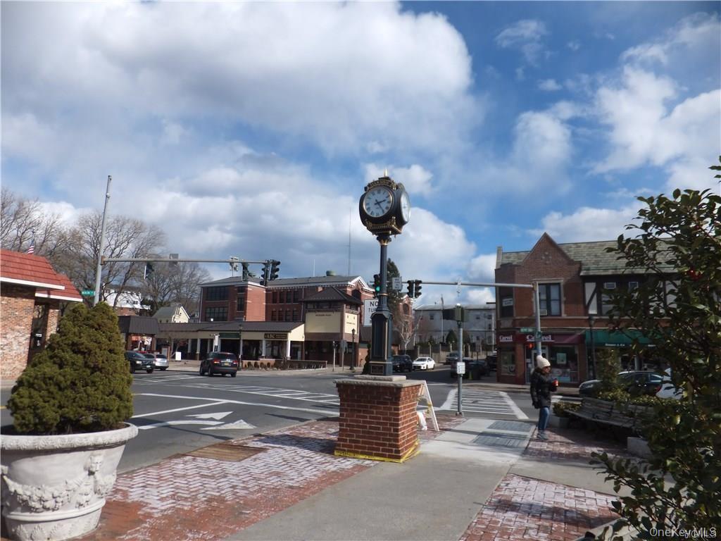 107 Kensington Road, Unit 5 Bronxville, NY 10708 - Photo 15 of 17 View of asphalt road with sidewalks, traffic lights, curbs, and street lighting