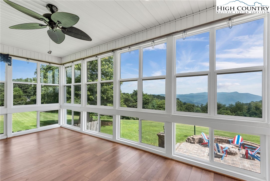 51 Horton Road Ennice, NC 28623 - Photo 23 of 44 a view of an empty room with wooden floor and a large window