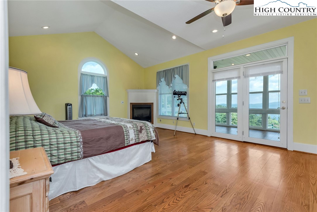 51 Horton Road Ennice, NC 28623 - Photo 36 of 44 a spacious bedroom with a bed and a dresser next to a window