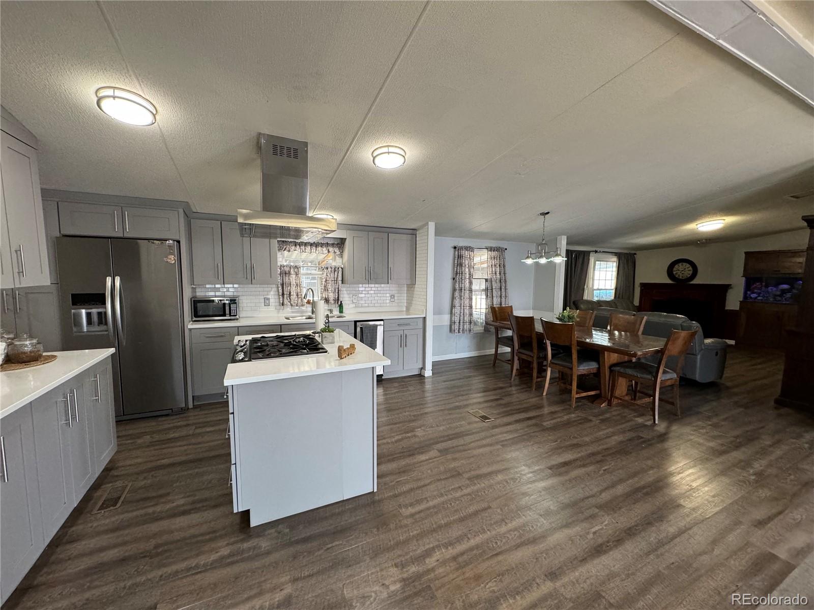 1921 Quintero Street Aurora, CO 80011 - Photo 3 of 18 a kitchen with lots of counter top space