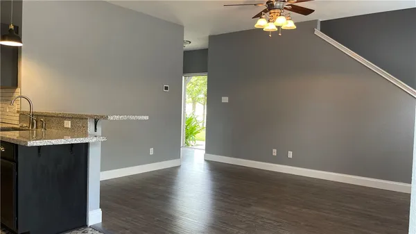 wooden floor in an empty room with a mirror