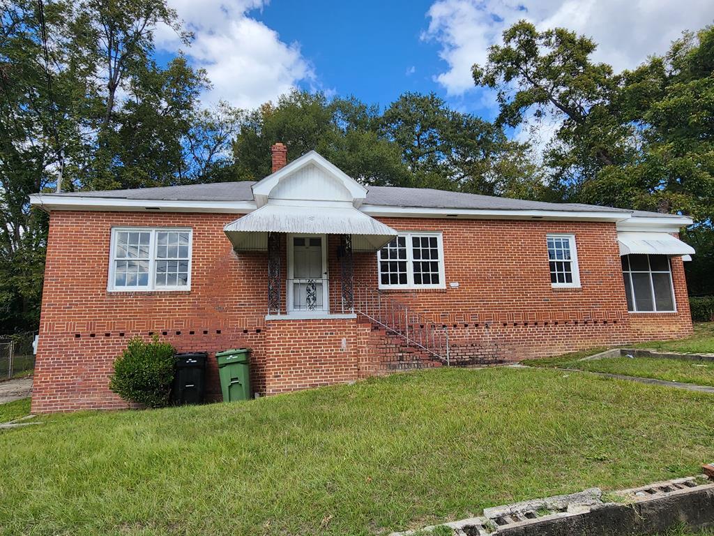 2939 Hood Street Columbus, GA 31906 - Photo 1 of 8 a front view of a house with a garden
