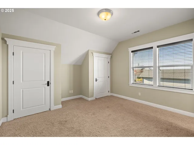 a view of a lake with a yard