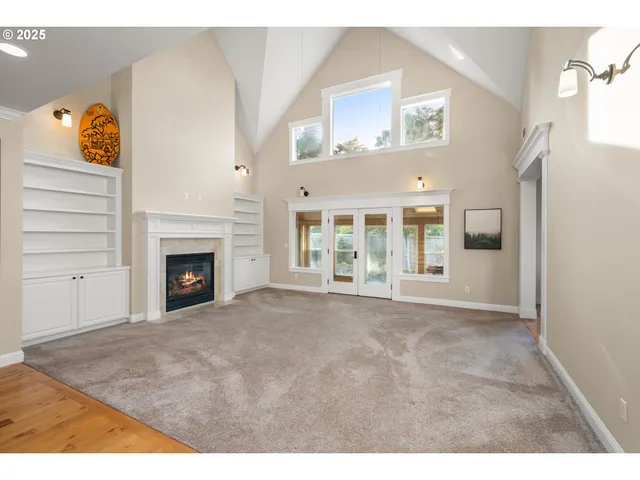 a view of an empty room and fire place