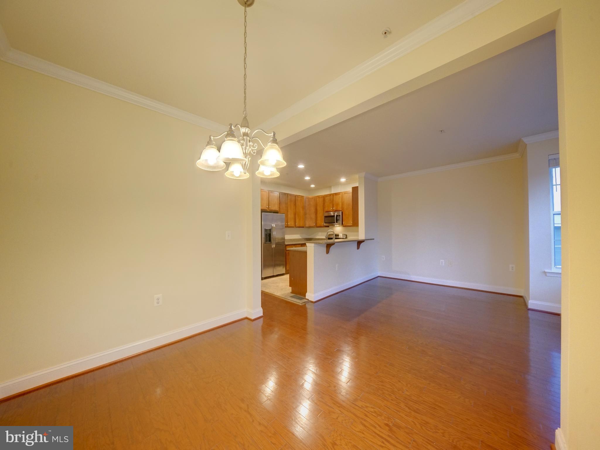 11205 Chase Street, Unit 63 Fulton, MD 20759 - Photo 15 of 22 a view of a kitchen with a chandelier