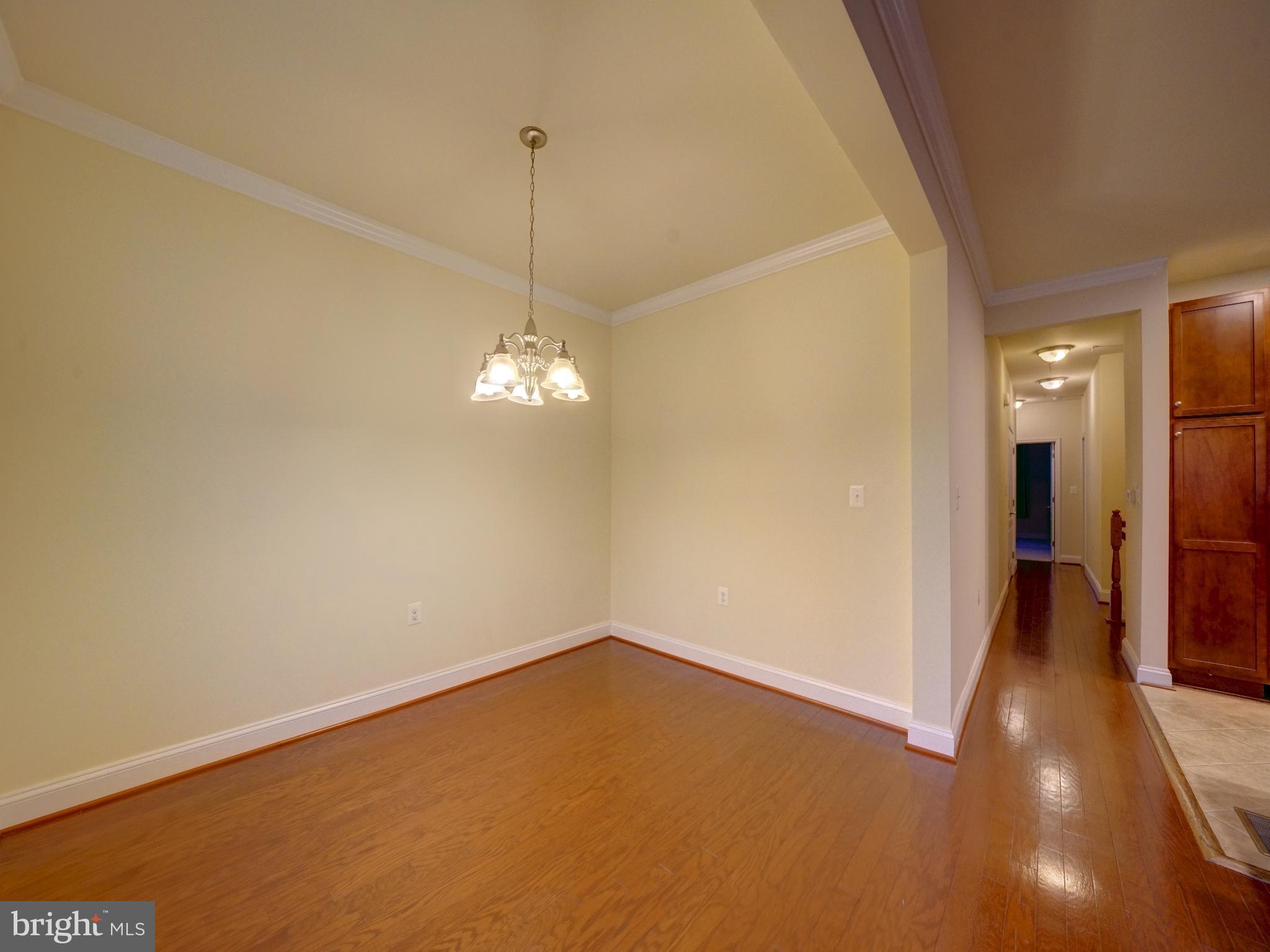 11205 Chase Street, Unit 63 Fulton, MD 20759 - Photo 16 of 22 a view of a room with a chandelier fan and wooden floor