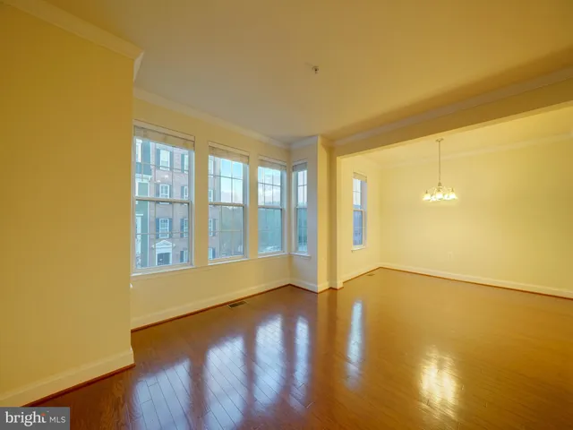a view of an empty room with glass door