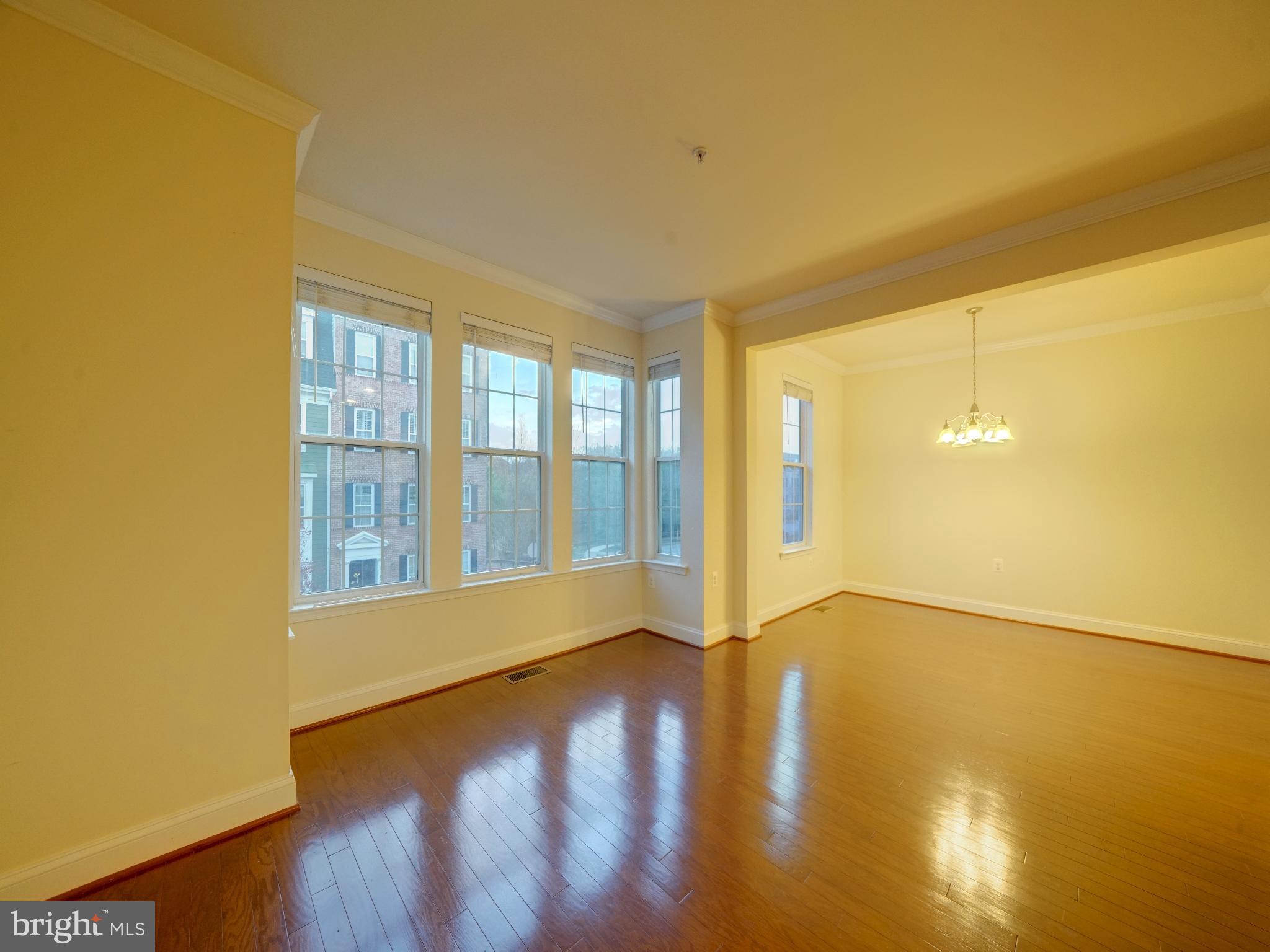 11205 Chase Street, Unit 63 Fulton, MD 20759 - Photo 21 of 22 a view of an empty room with glass door