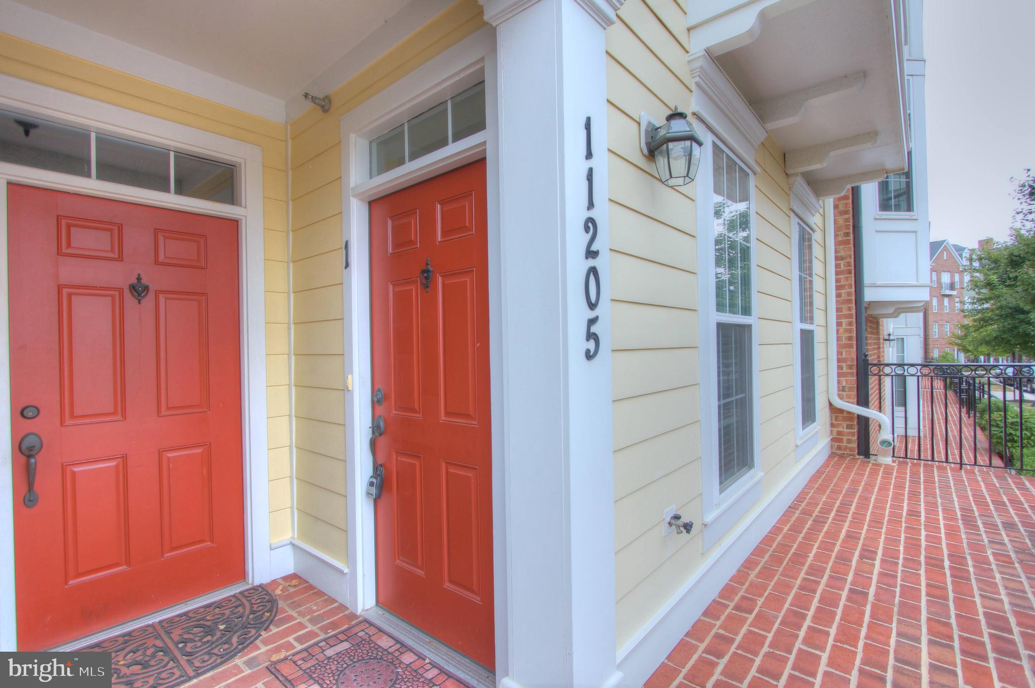 11205 Chase Street, Unit 63 Fulton, MD 20759 - Photo 3 of 22 a view of a hallway with wooden floor and entryway