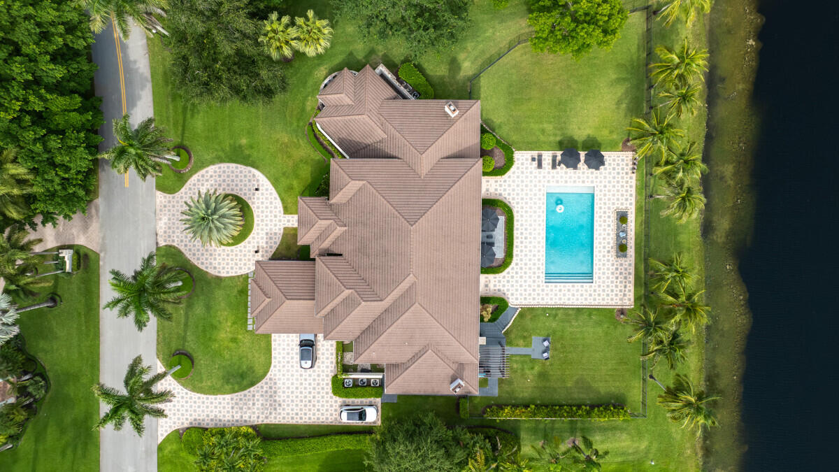 3500 Windmill Ranch Road Weston, FL 33331 - Photo 41 of 47 an aerial view of a swimming pool with outdoor seating and yard