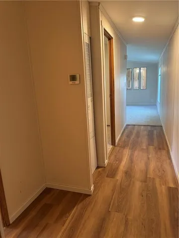 a view of an empty room with windows