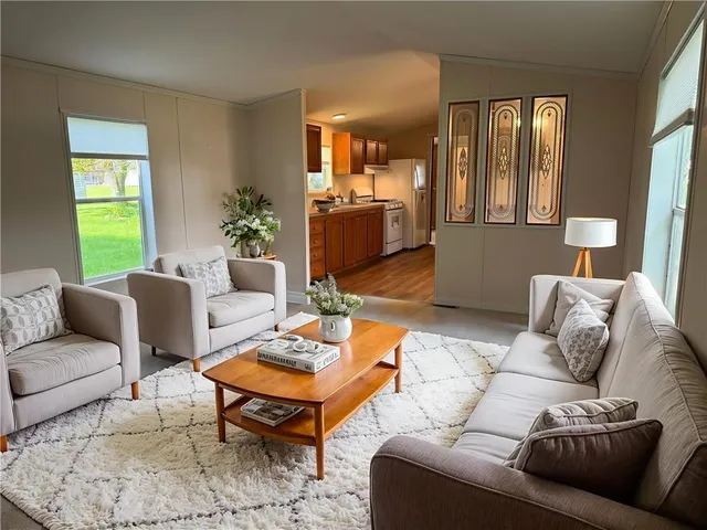 a living room with furniture and a window