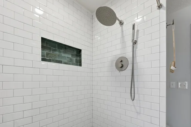 a kitchen with stainless steel appliances granite countertop white cabinets a sink and dishwasher