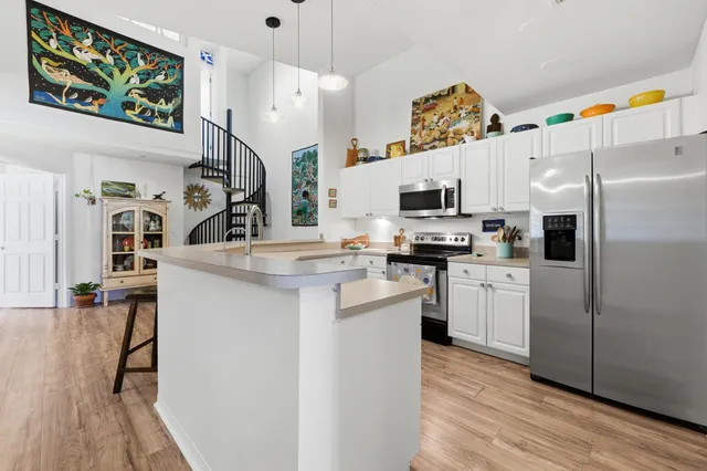 a view of a park with swings and slides