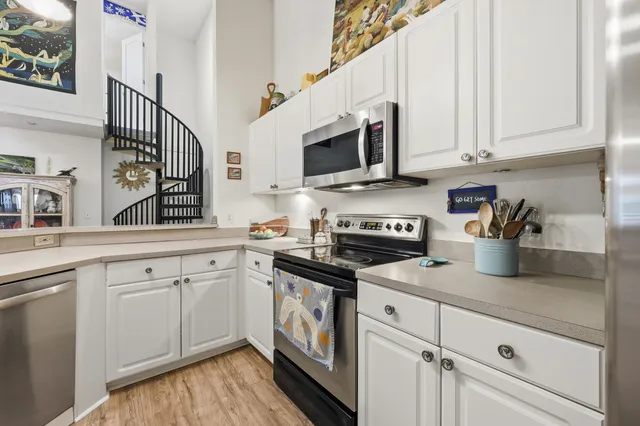 an aerial view of a house with a garden and plants