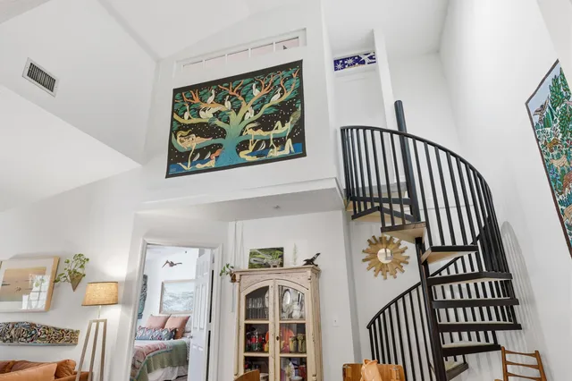 a bathroom with a toilet and shower