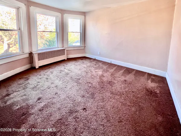 a view of a room that has a window in it