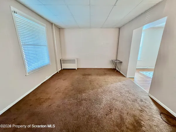 a kitchen with stainless steel appliances granite countertop a sink stove refrigerator and cabinets