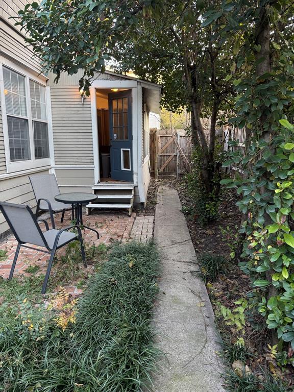 4347 Travis Street, Unit 4347 Dallas, TX 75205 - Photo 11 of 12 a yellow house with trees in front of it