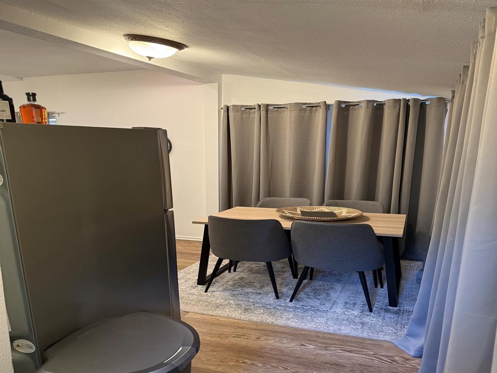 4347 Travis Street, Unit 4347 Dallas, TX 75205 - Photo 4 of 12 a workspace with furniture and a rug