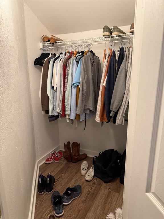 4347 Travis Street, Unit 4347 Dallas, TX 75205 - Photo 5 of 12 a view of walk in closet with clothes and shoes