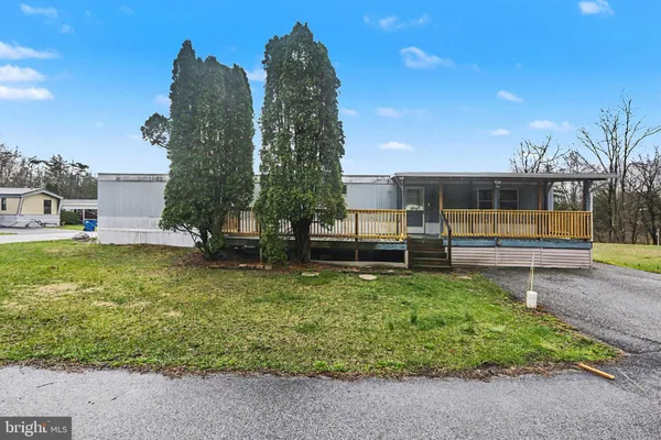 a view of backyard with swimming pool