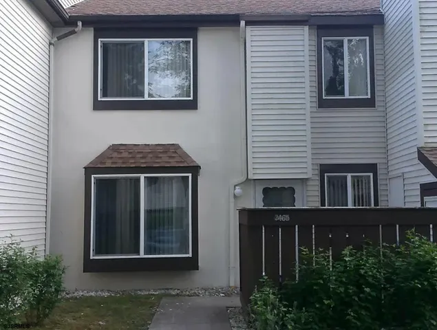 a front view of a house with yard