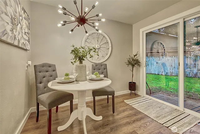 a view of a dining room with furniture window and wooden floor