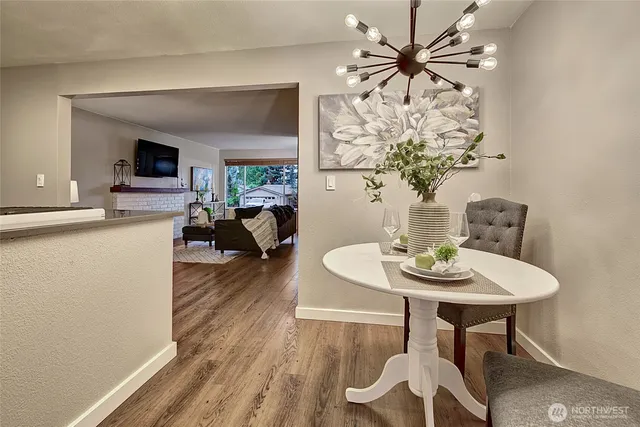 a view of a dining room with furniture window and wooden floor