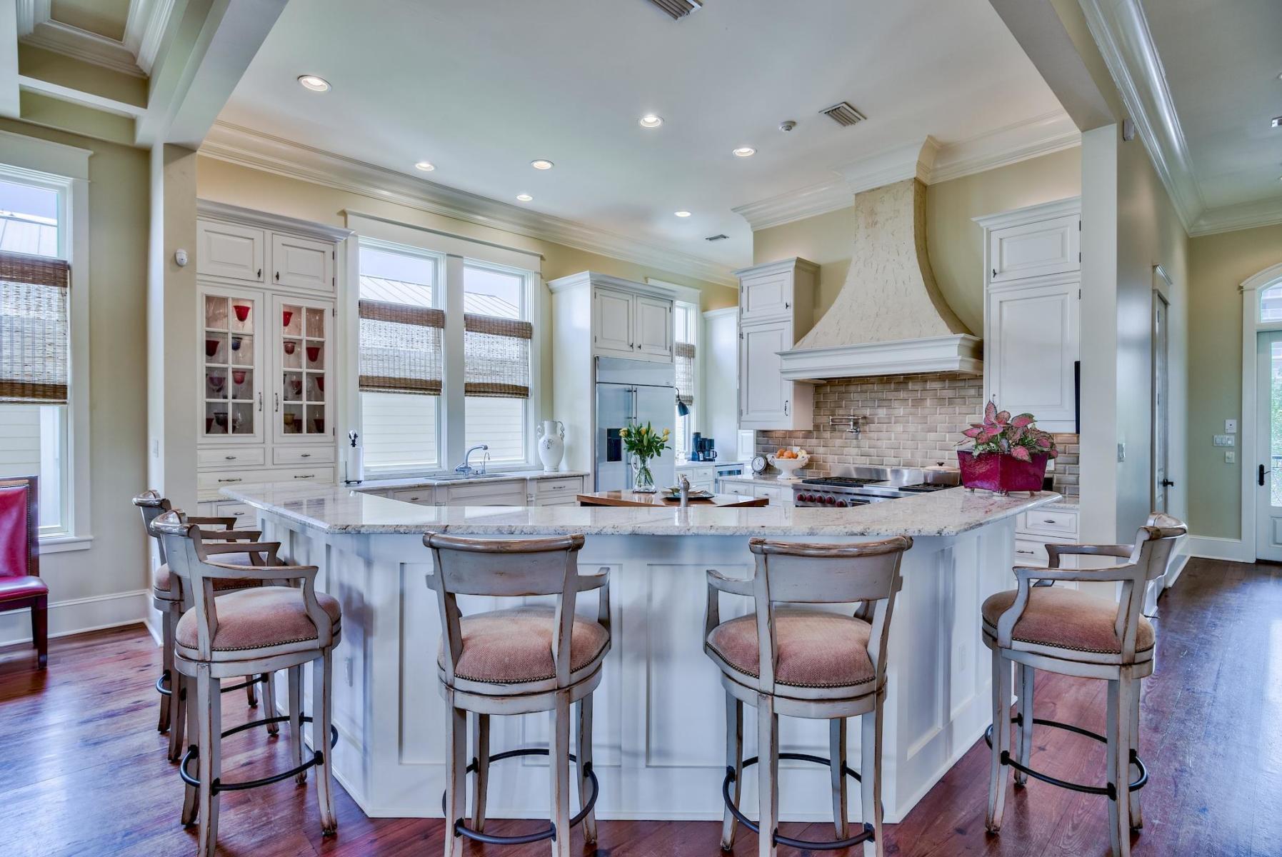216 Sandtrap Road Miramar Beach, FL 32550 - Photo 13 of 58 a kitchen with granite countertop a dining table chairs sink and cabinets
