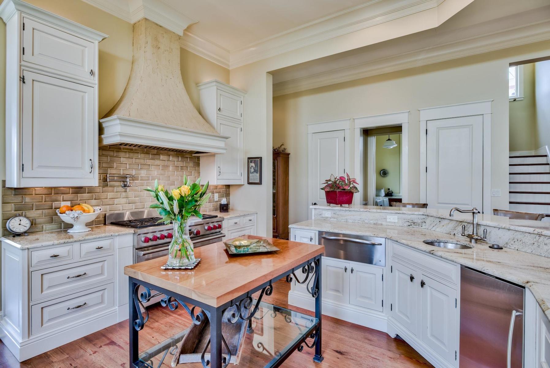 216 Sandtrap Road Miramar Beach, FL 32550 - Photo 15 of 58 a view of a kitchen area with furniture and wooden floor