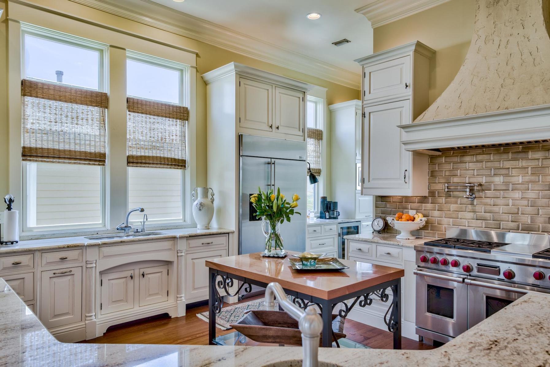 216 Sandtrap Road Miramar Beach, FL 32550 - Photo 16 of 58 a kitchen with a stove a sink and a refrigerator
