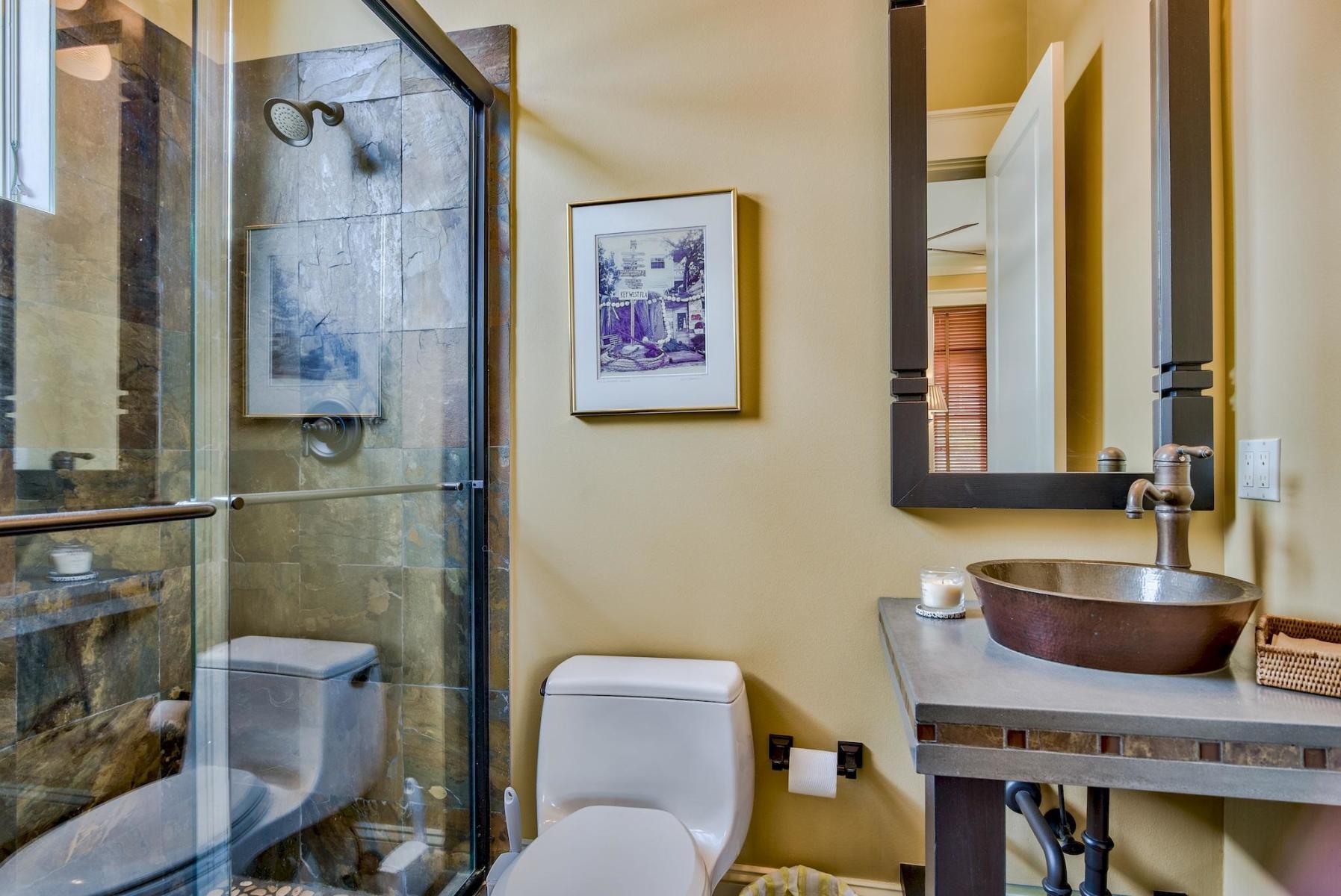 216 Sandtrap Road Miramar Beach, FL 32550 - Photo 21 of 58 a bathroom with a granite countertop toilet a sink and a mirror
