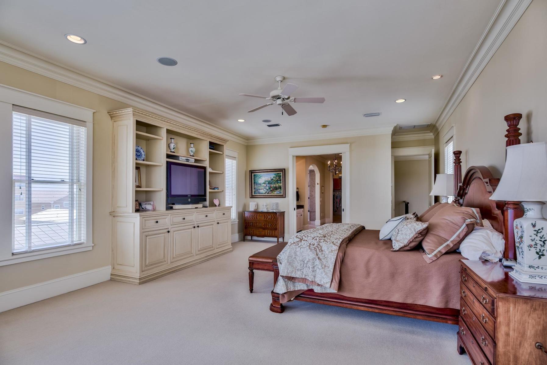 216 Sandtrap Road Miramar Beach, FL 32550 - Photo 31 of 58 a bedroom with a bed a flat screen tv and dresser