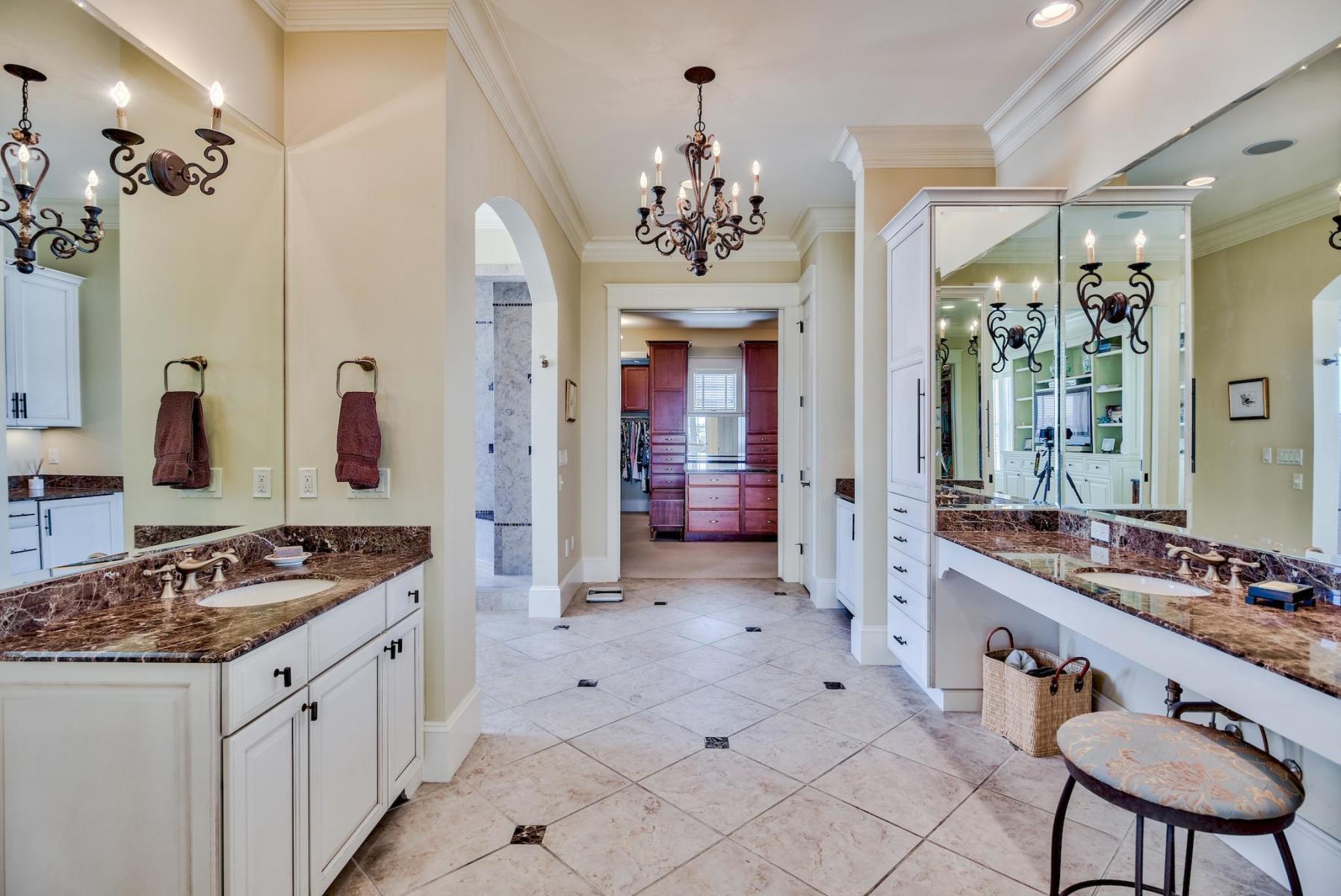 216 Sandtrap Road Miramar Beach, FL 32550 - Photo 32 of 58 a spacious bathroom with a granite countertop sink a mirror a shower and a bathtub