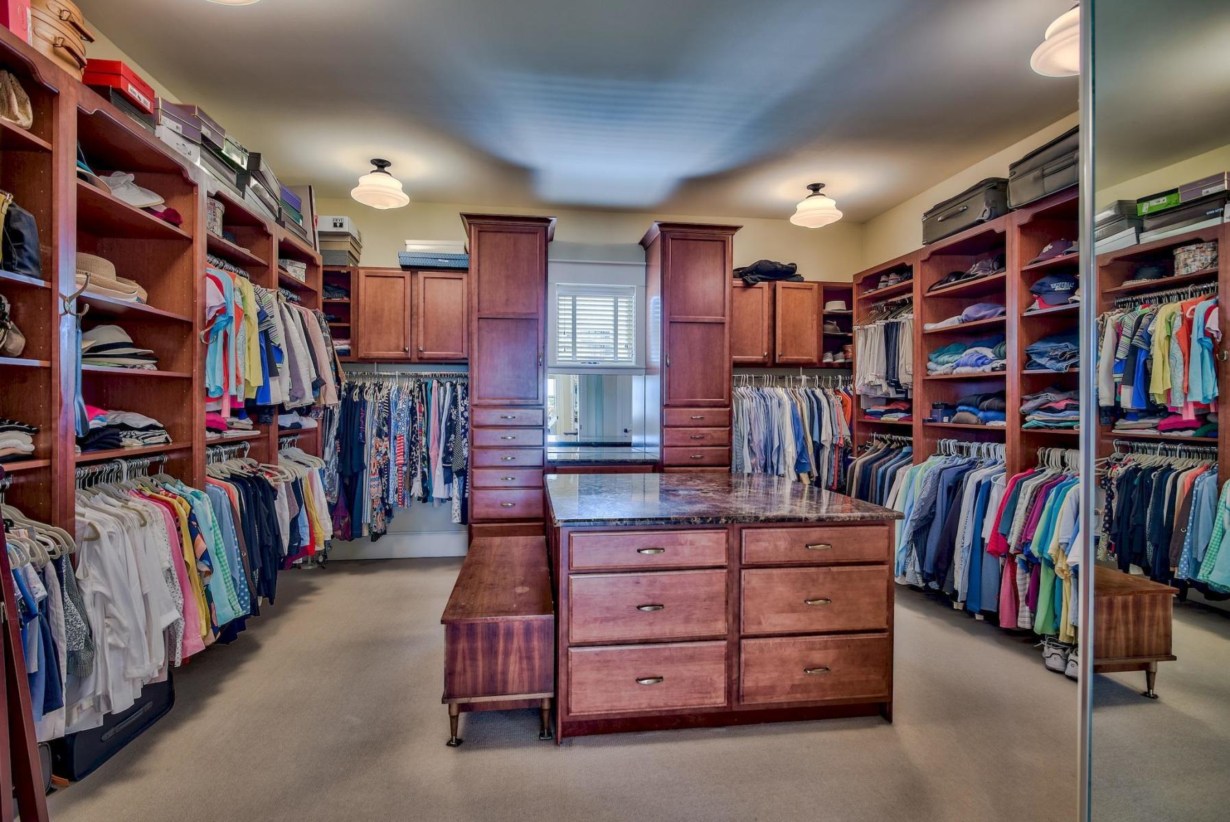 216 Sandtrap Road Miramar Beach, FL 32550 - Photo 35 of 58 a view of walk in closet with clothes and shoes