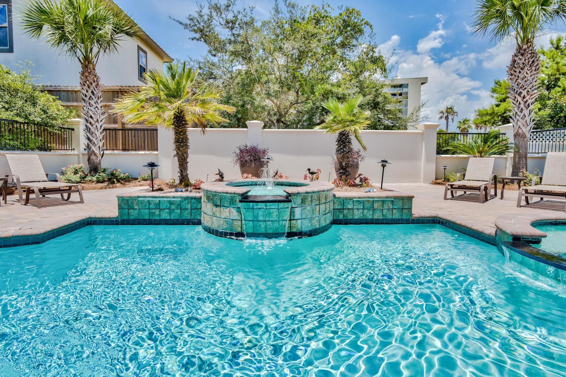 216 Sandtrap Road Miramar Beach, FL 32550 - Photo 50 of 58 a view of a house with a backyard and a patio