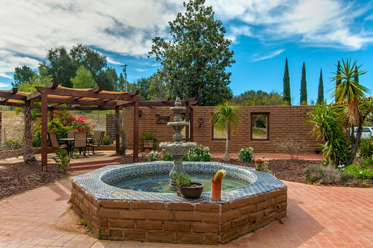 18011 Bluegrass Road Ramona, CA 92065 - Photo 3 of 25 Courtyard with water feature and seating area