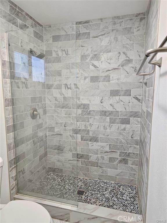 769 East 7th Street, Unit B Upland, CA 91786 - Photo 11 of 12 a bathroom with a toilet and shower