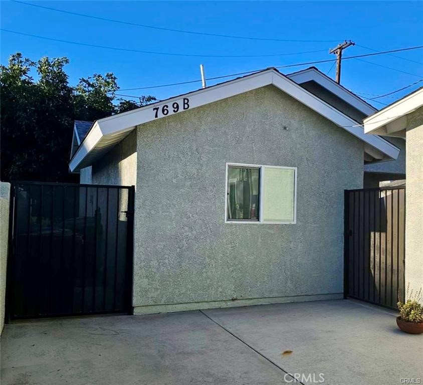 769 East 7th Street, Unit B Upland, CA 91786 - Photo 12 of 12 a view of a house with a garage