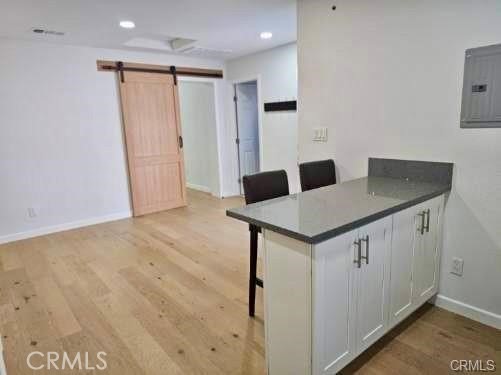 769 East 7th Street, Unit B Upland, CA 91786 - Photo 5 of 12 a kitchen that has a microwave a sink and a stove in it