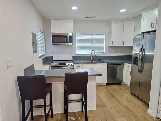 a kitchen with a washer and dryer