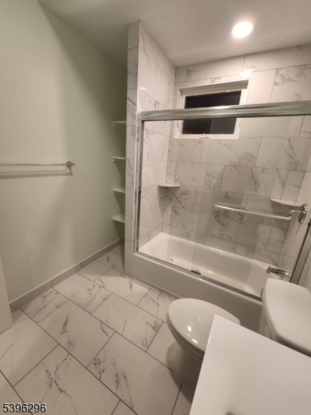 229 East 24th Street Paterson, NJ 07514 - Photo 10 of 15 a bathroom with a bathtub and toilet