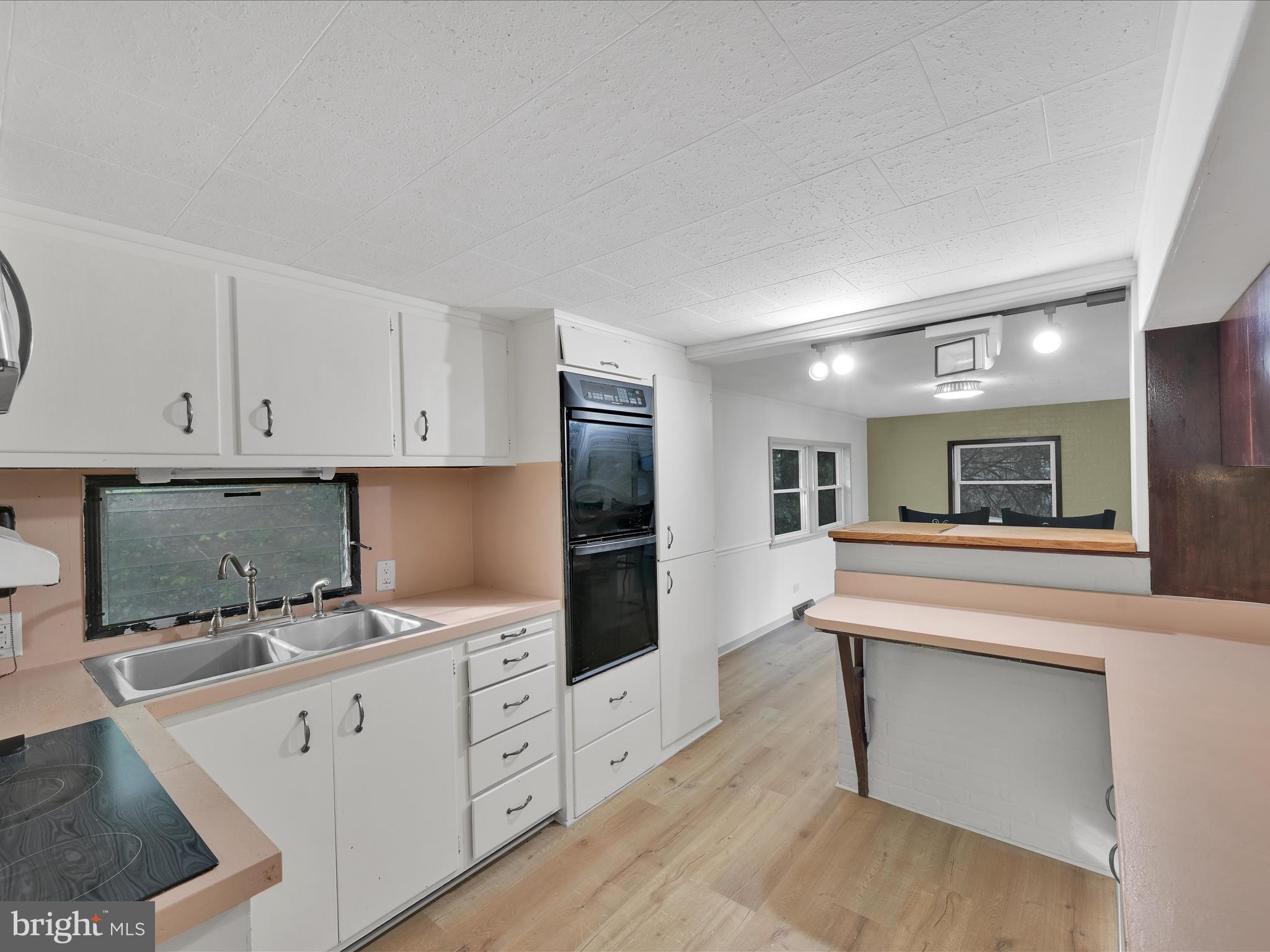 148 Mexico Road Pine Grove, PA 17963 - Photo 11 of 33 a kitchen with granite countertop white cabinets and white appliances