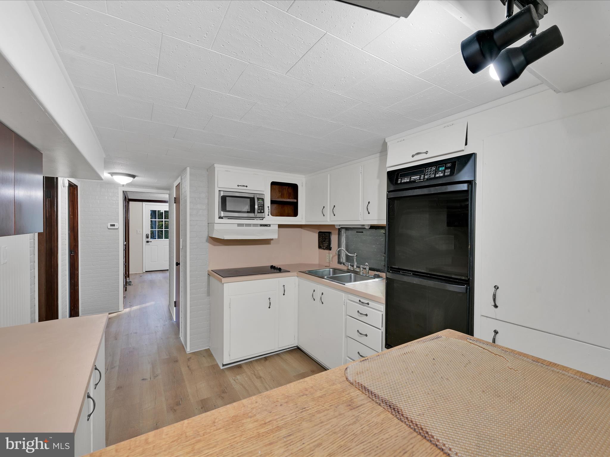 148 Mexico Road Pine Grove, PA 17963 - Photo 12 of 33 a kitchen with stainless steel appliances a refrigerator stove microwave and cabinets