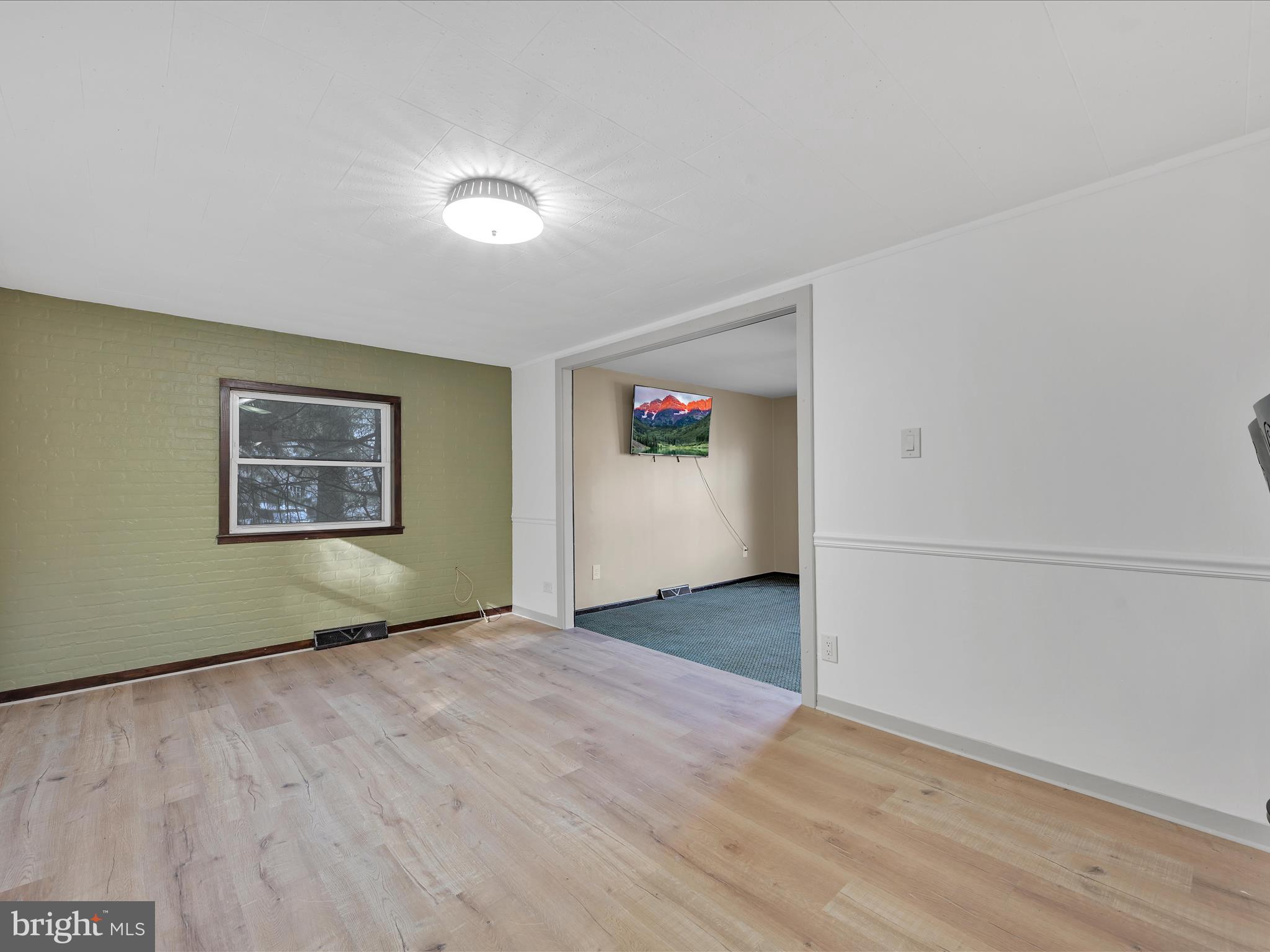 148 Mexico Road Pine Grove, PA 17963 - Photo 8 of 33 an empty room with wooden floor and windows